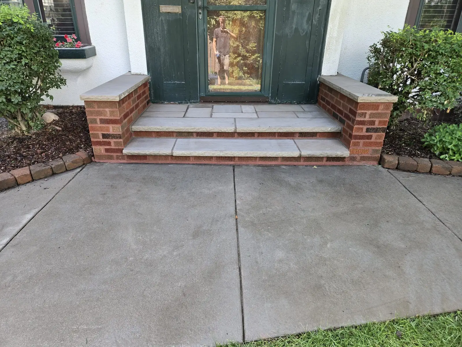 Stone entry steps with brick piers
